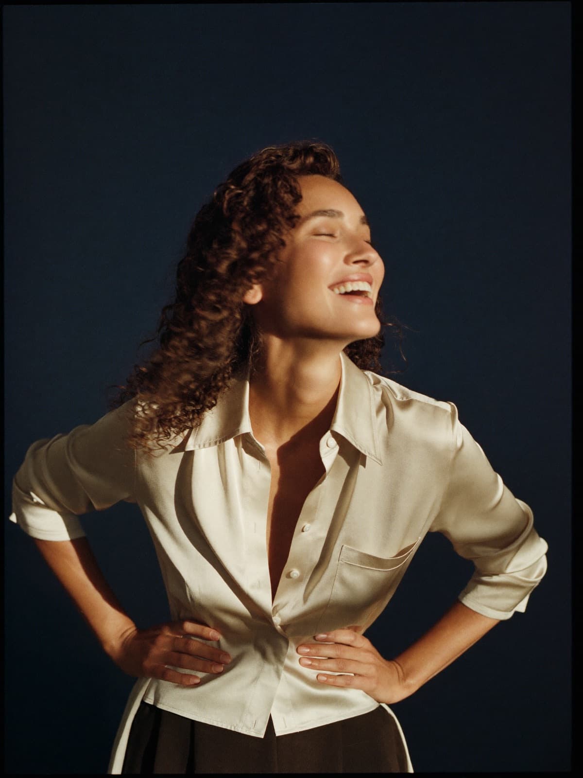 A woman in golden light, radiant and confident